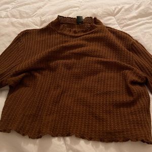 Large brown flared armed high rise neck crop top